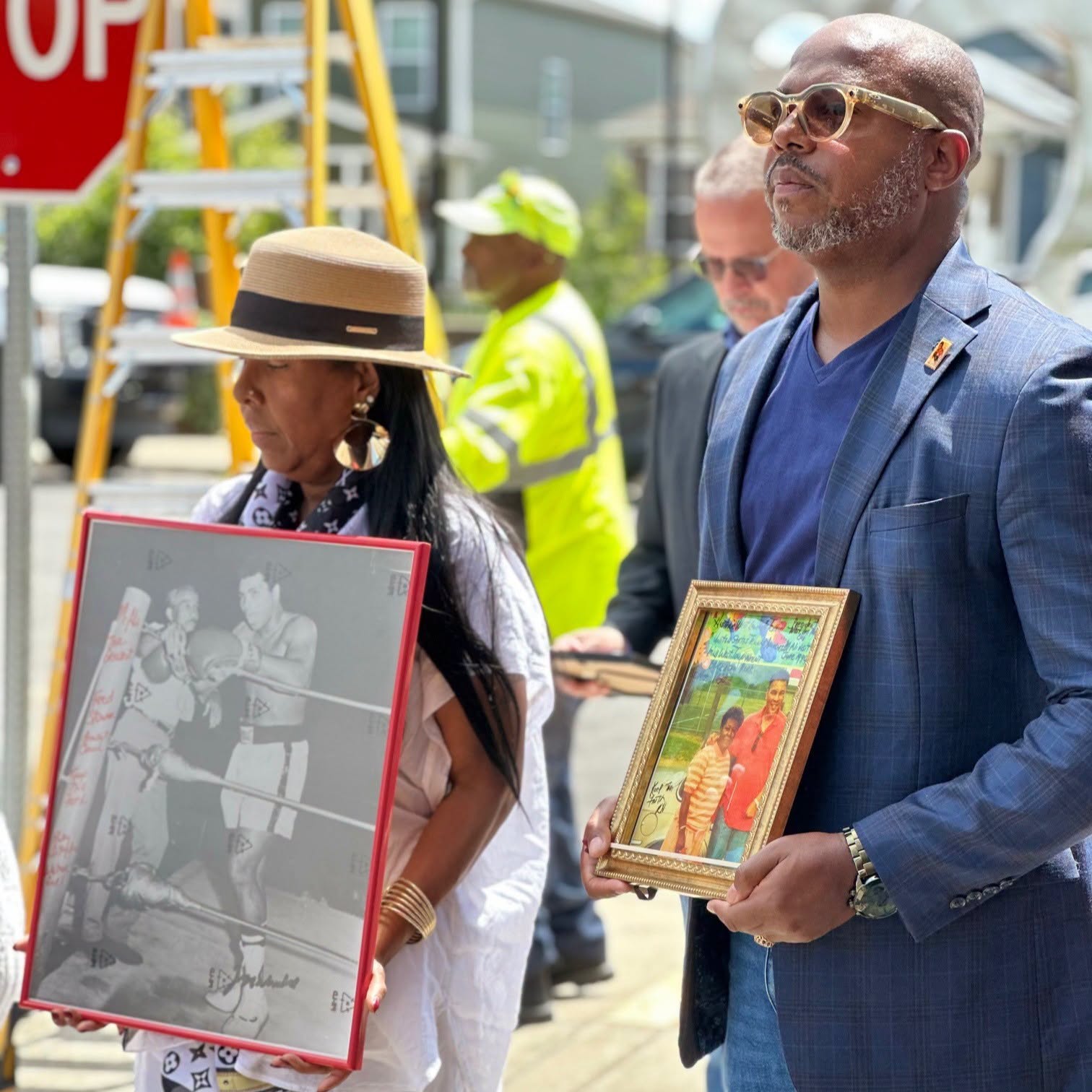 Framed photos of Fred T. Stoner Sr. held during the dedication